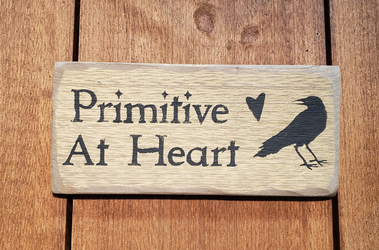 Primitive barnwood sign with the words Primitive At Heart with a crow and heart