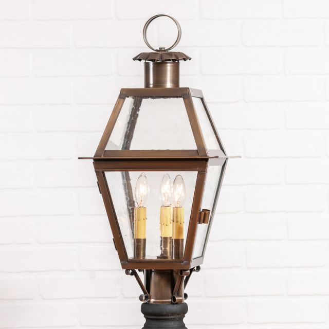 Primitive brass post light with three bulbs