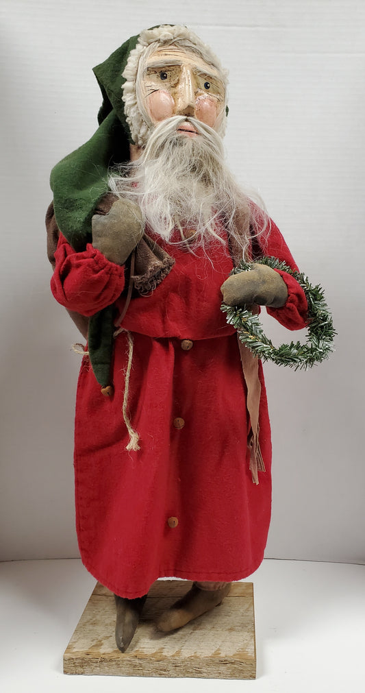 Primitive Clay Faced Santa Holding Wreath and Sack