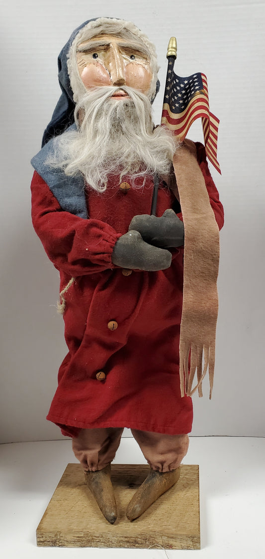 Primitive Clay Faced Santa Holding Flag