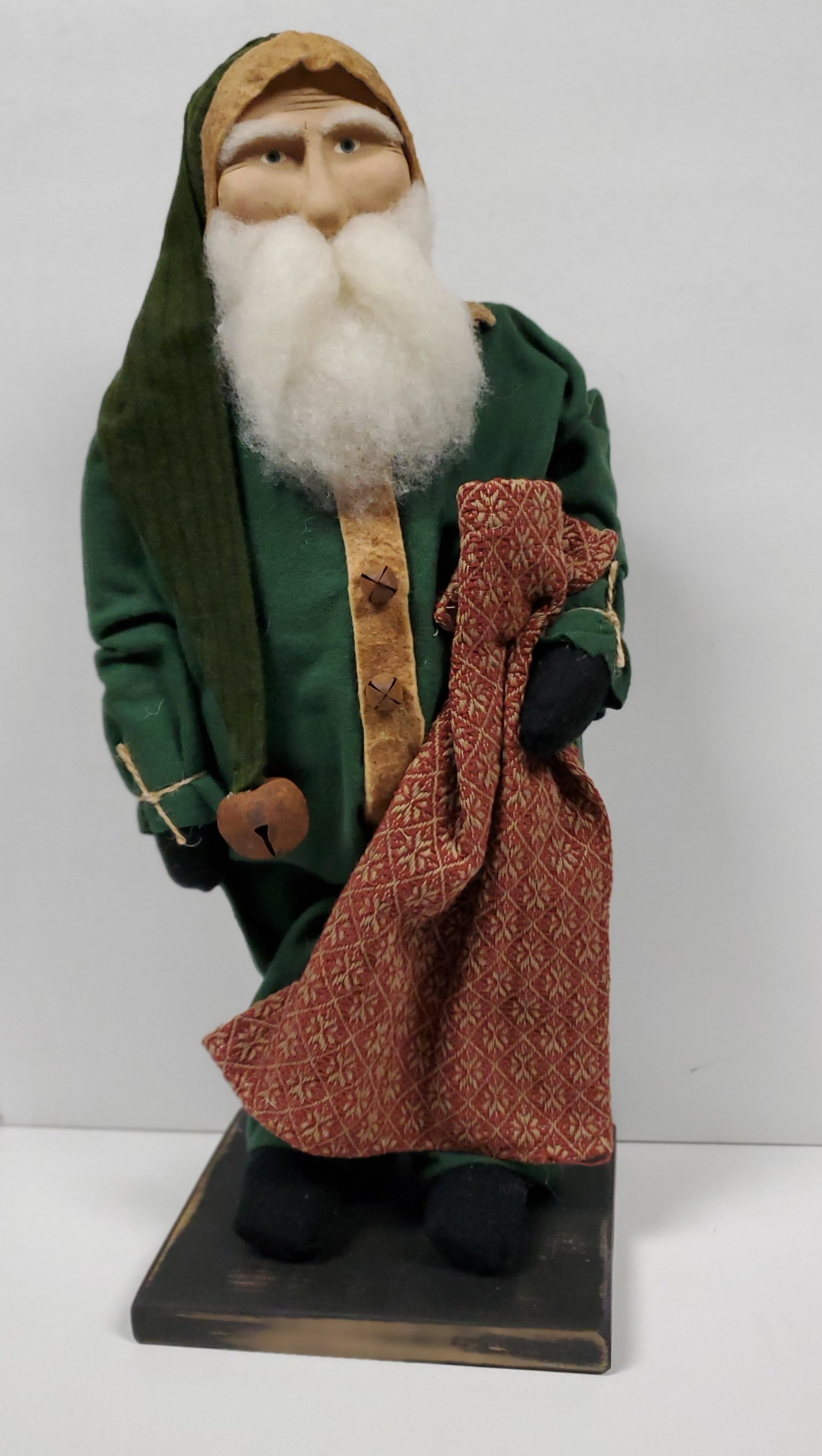 Primitive santa holding blanket