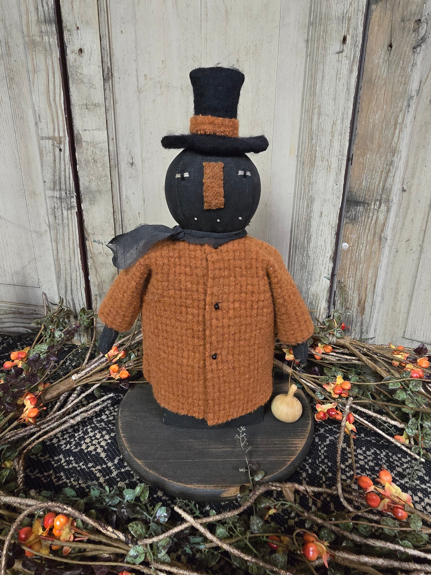 Black Pumpkin Man with Orange Coat and Gourd