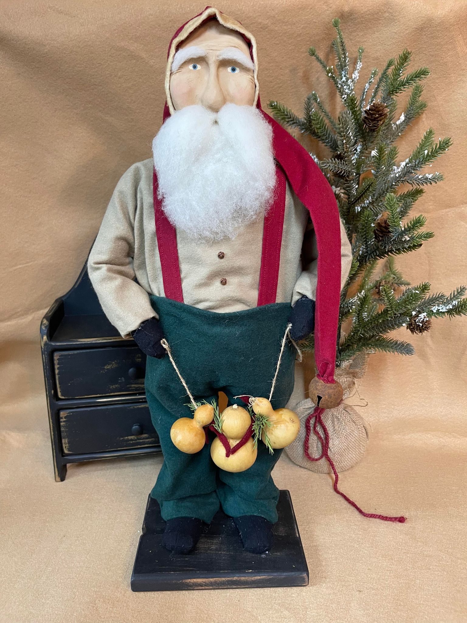 Primitive santa holding gourd garland 