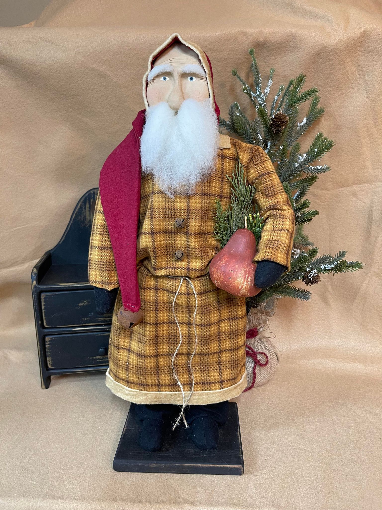 Primitive santa with pear and greenery