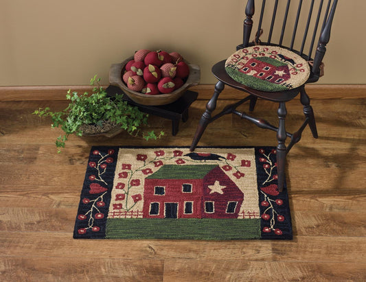 Primitive hooked rug with red house and crow