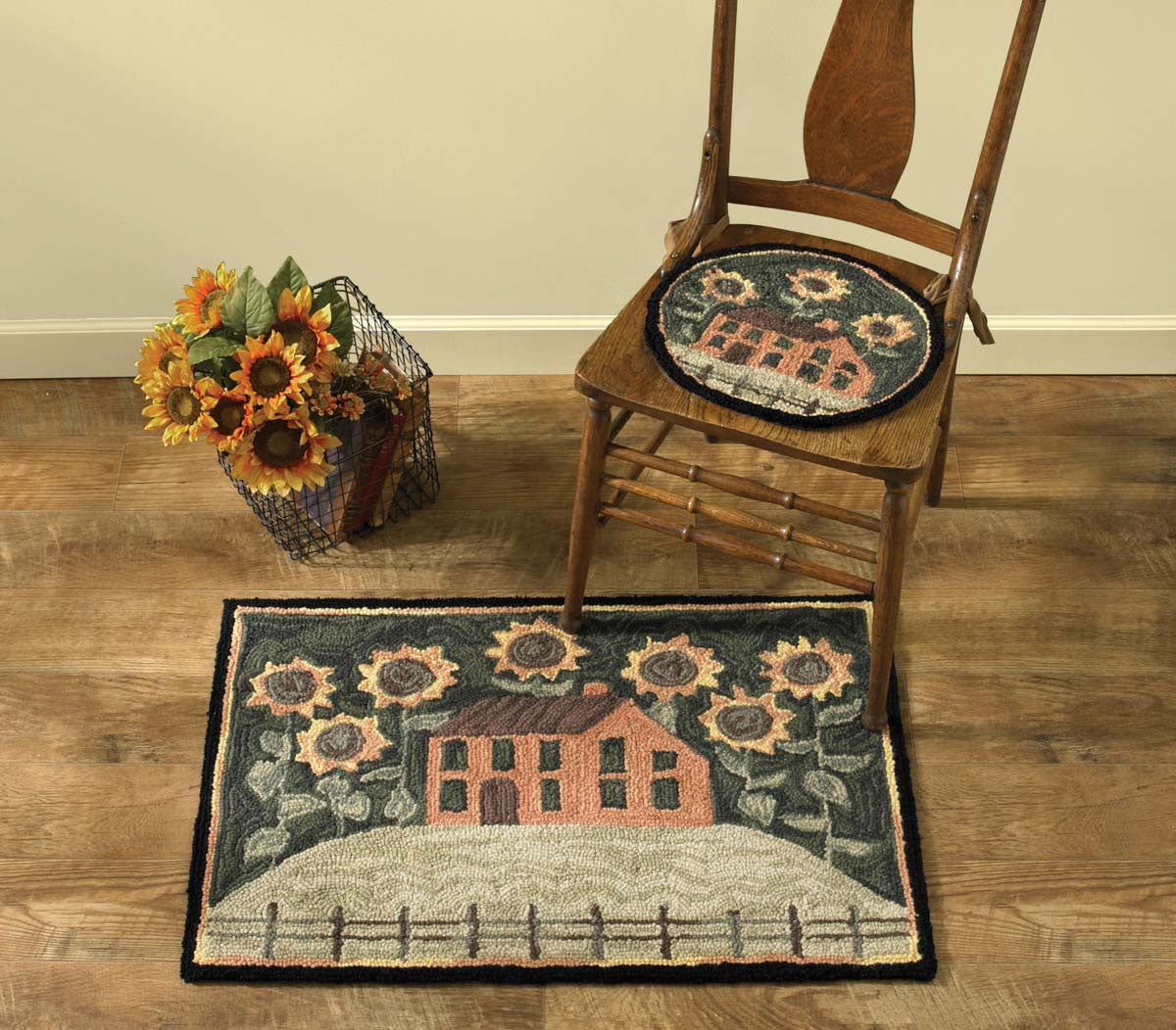 Primitive hooked rug with house and sunflowers