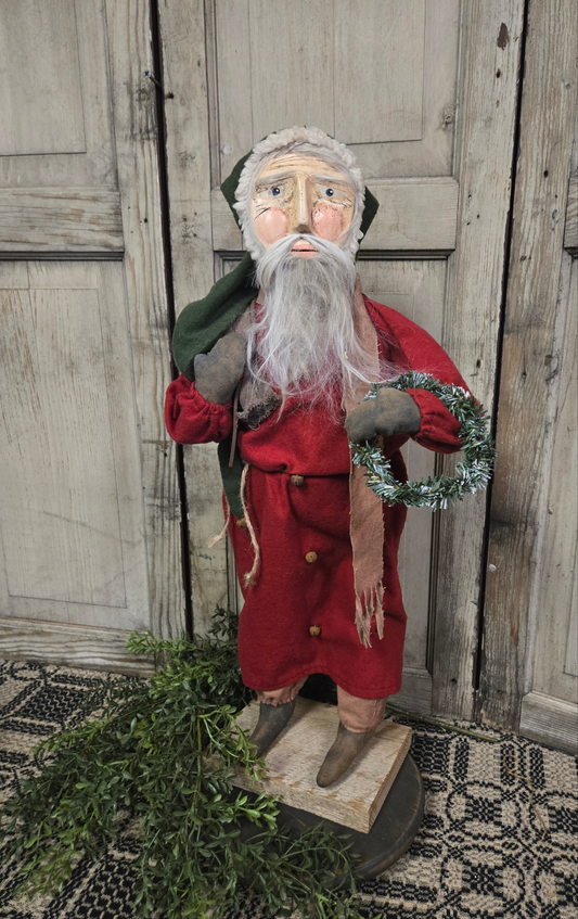 Primitive Santa Holding Wreath and Sack