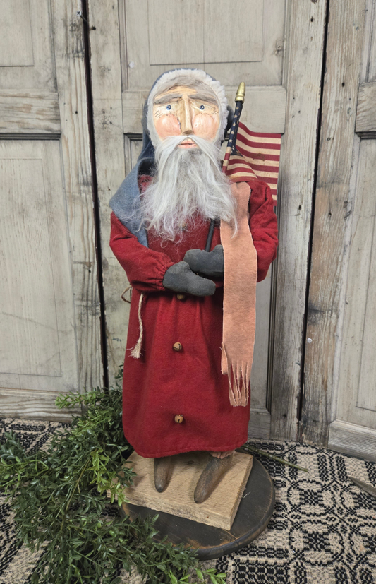 Primitive Santa Holding Flag