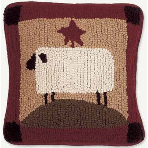 Primitive hooked pillow with sheep and star