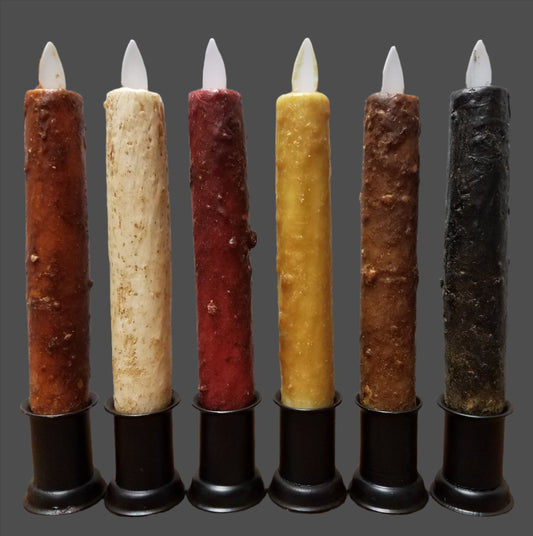 Moving flame taper candles that come in various colors