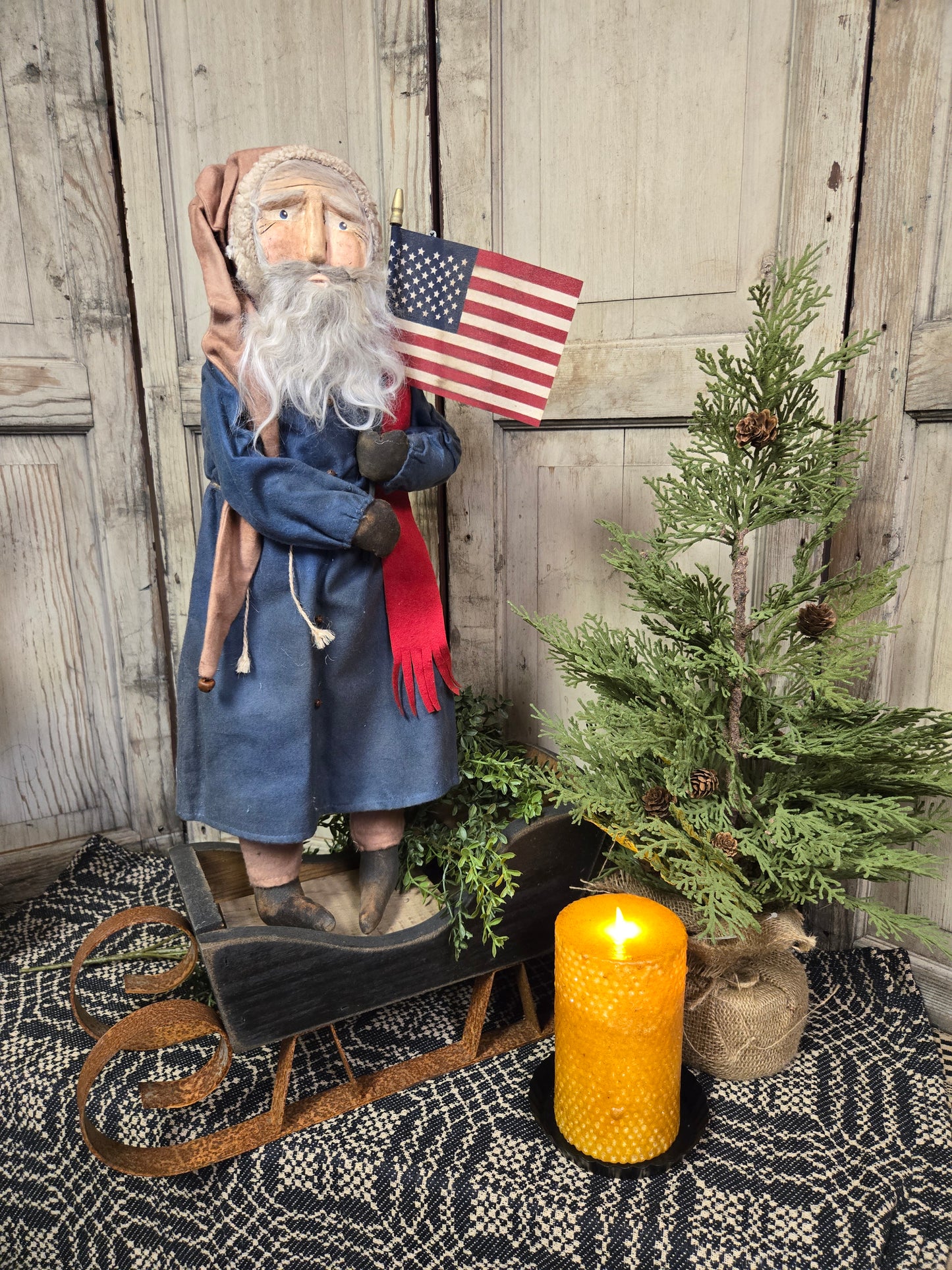 Primitive Santa Holding Flag Wearing Tan Pants