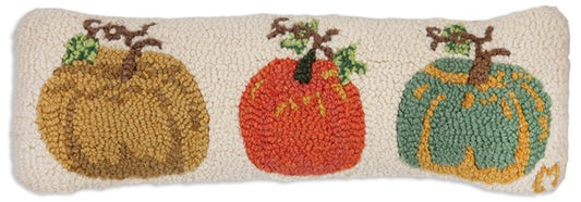 Primitive hooked pillow with three pumpkins